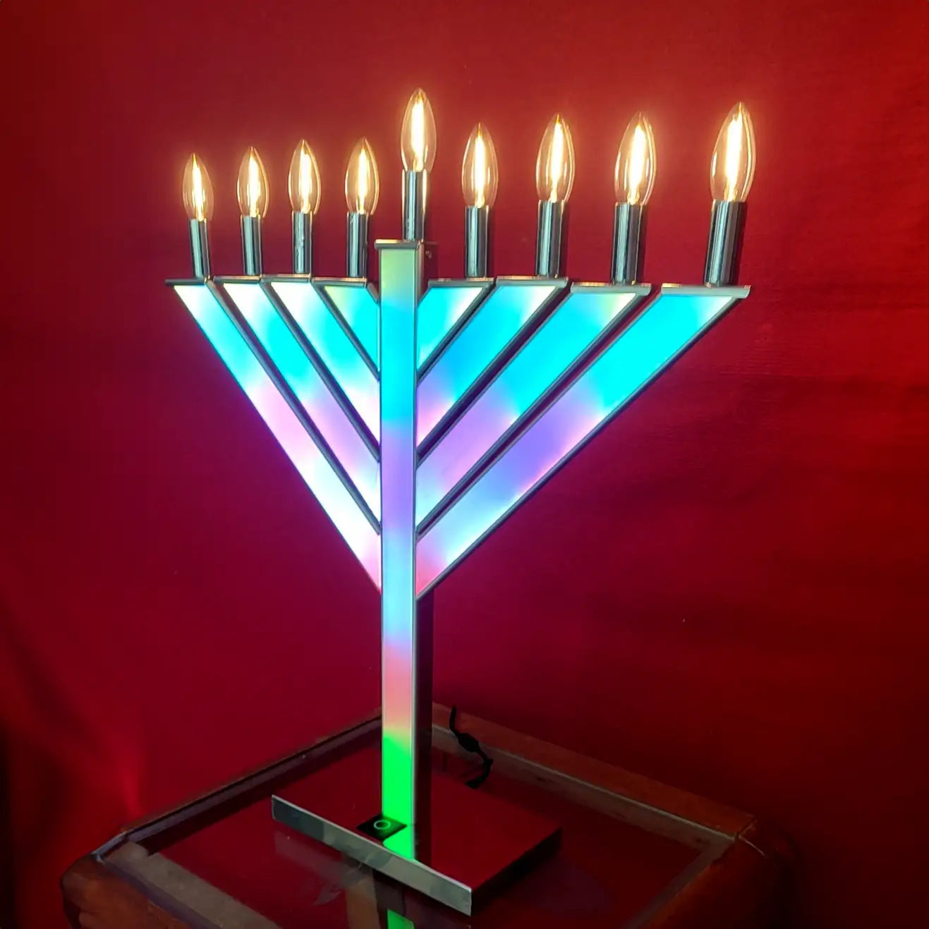 Colorful Menorah with lit candles