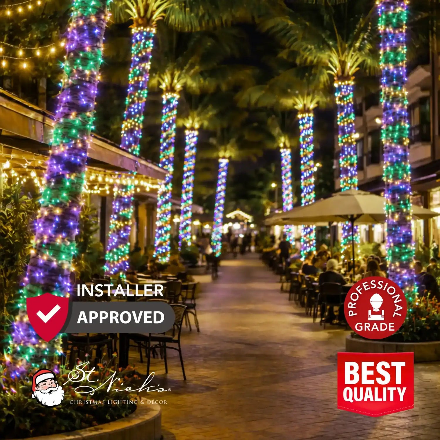 Commercial-grade French Quarter Color Palette LED mini lights wrapped around palm trees in an outdoor shopping and dining area