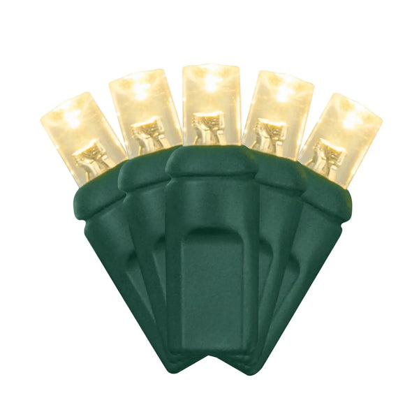 Warm white 5mm LED mini light bulbs with green wire and 4-inch spacing on a white background