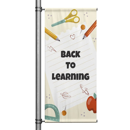 Back to Learning school pole banner with cream background, notebook paper design, pencils, scissors, apple, and playful educational illustrations