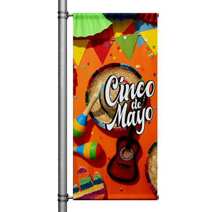 Cinco de Mayo pole banner with bright orange background featuring sombrero, maracas, guitar, papel picado, and festive Mexican décor