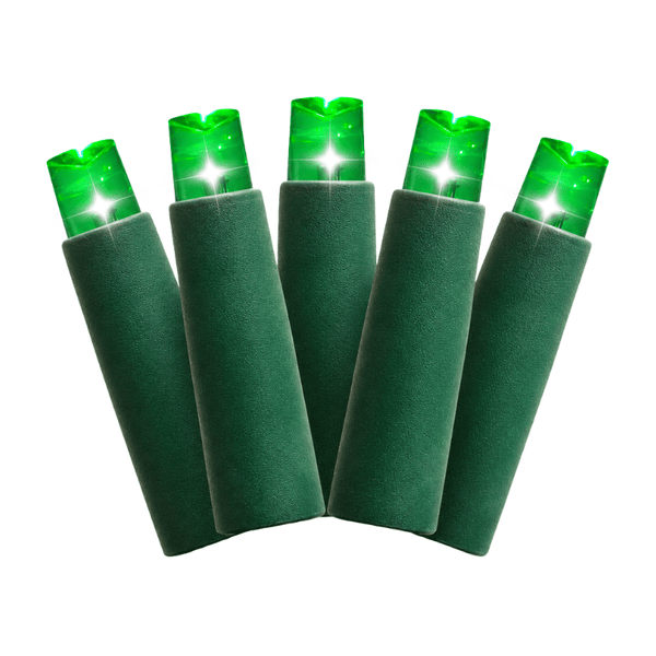 Close-up of five glowing green 5mm wide-angle concave LED mini-light bulbs in dark green sockets on a white background.