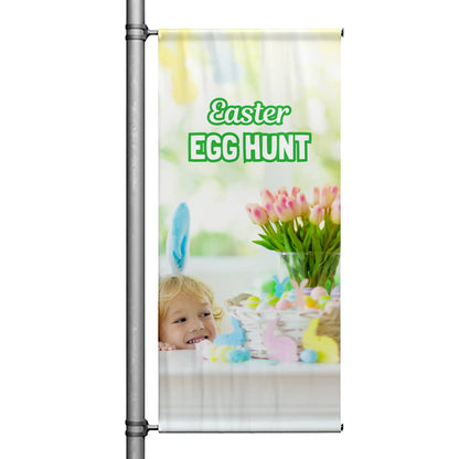 Easter Egg Hunt pole banner featuring child peeking at Easter basket, pastel eggs, and spring floral background