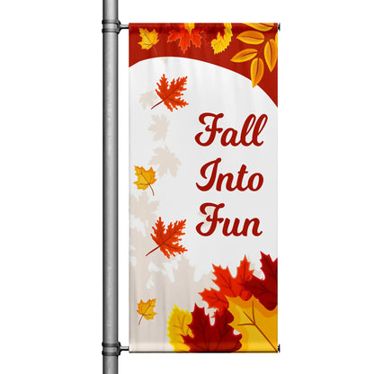 Fall Into Fun autumn pole banner with colorful falling leaves, warm fall tones, and seasonal typography