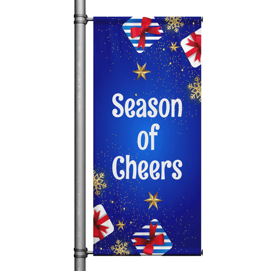 Season of Cheers Christmas pole banner with blue background, gold stars, snowflakes, and wrapped gift accents