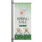 Spring Sale pole banner featuring floral bicycle illustration and pastel spring colors mounted on street pole