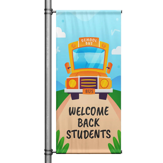 Welcome Back Students school pole banner featuring a yellow school bus, blue sky background, and cheerful back-to-school design
