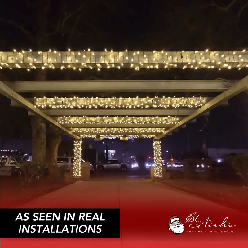 Warm white LED mini lights installed across a commercial pergola and wrapped around support columns