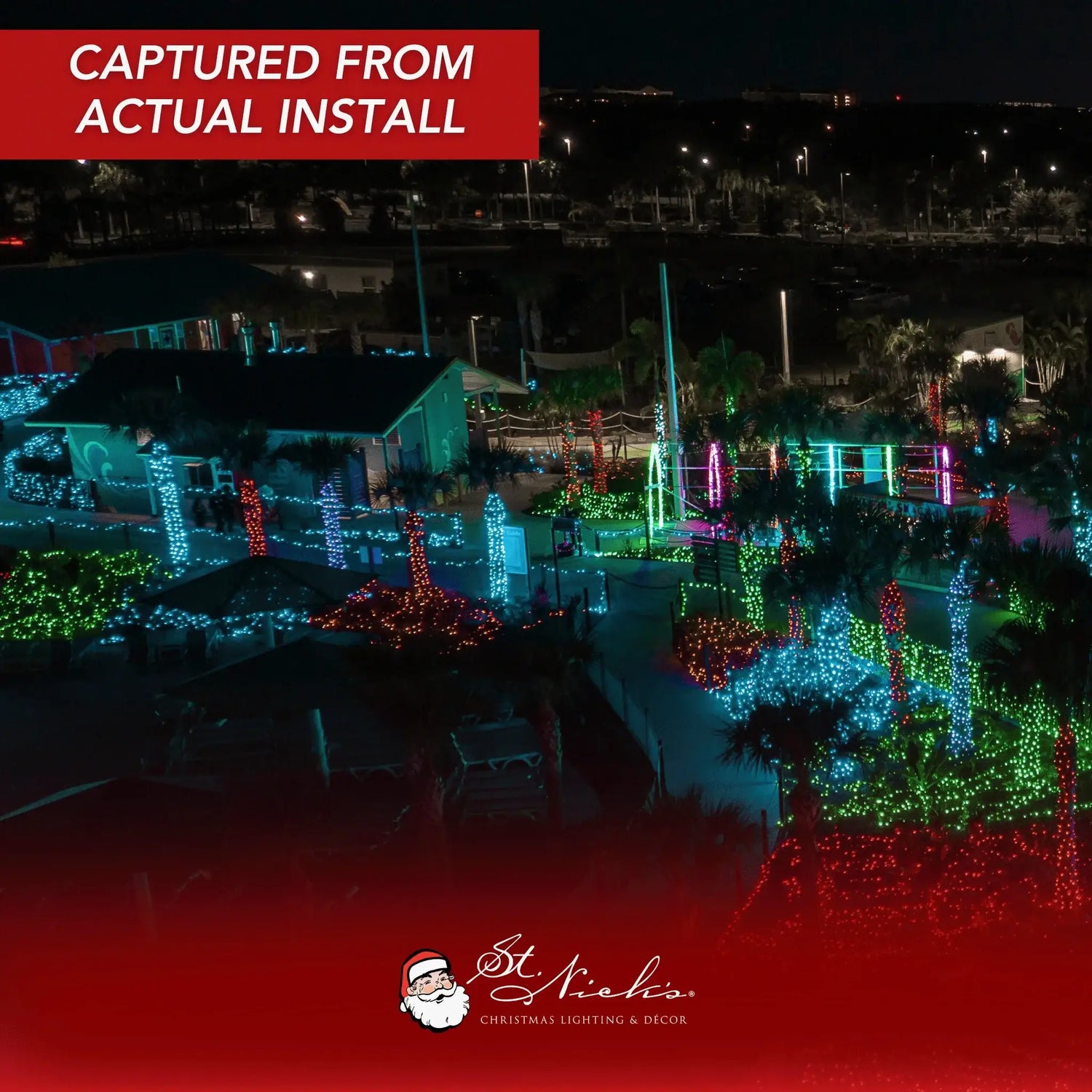 Aqua twinkle 5mm LED mini lights used across palm trees, landscaping, and architectural features in a large outdoor installation