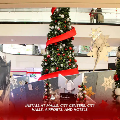 Decorative Christmas tree with red ribbon in a mall setting, featuring installation 