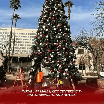 Decorated Christmas tree with red, white, and gold ornaments 