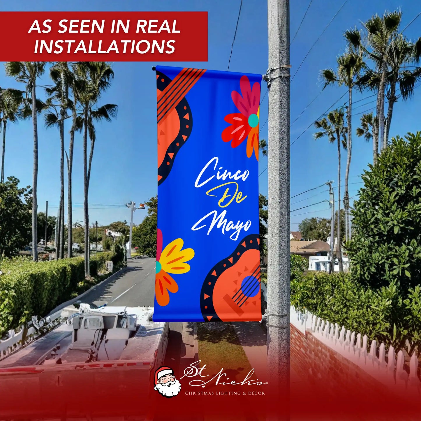 Cinco de Mayo blue guitar floral pole banner displayed on street pole in real-world installation