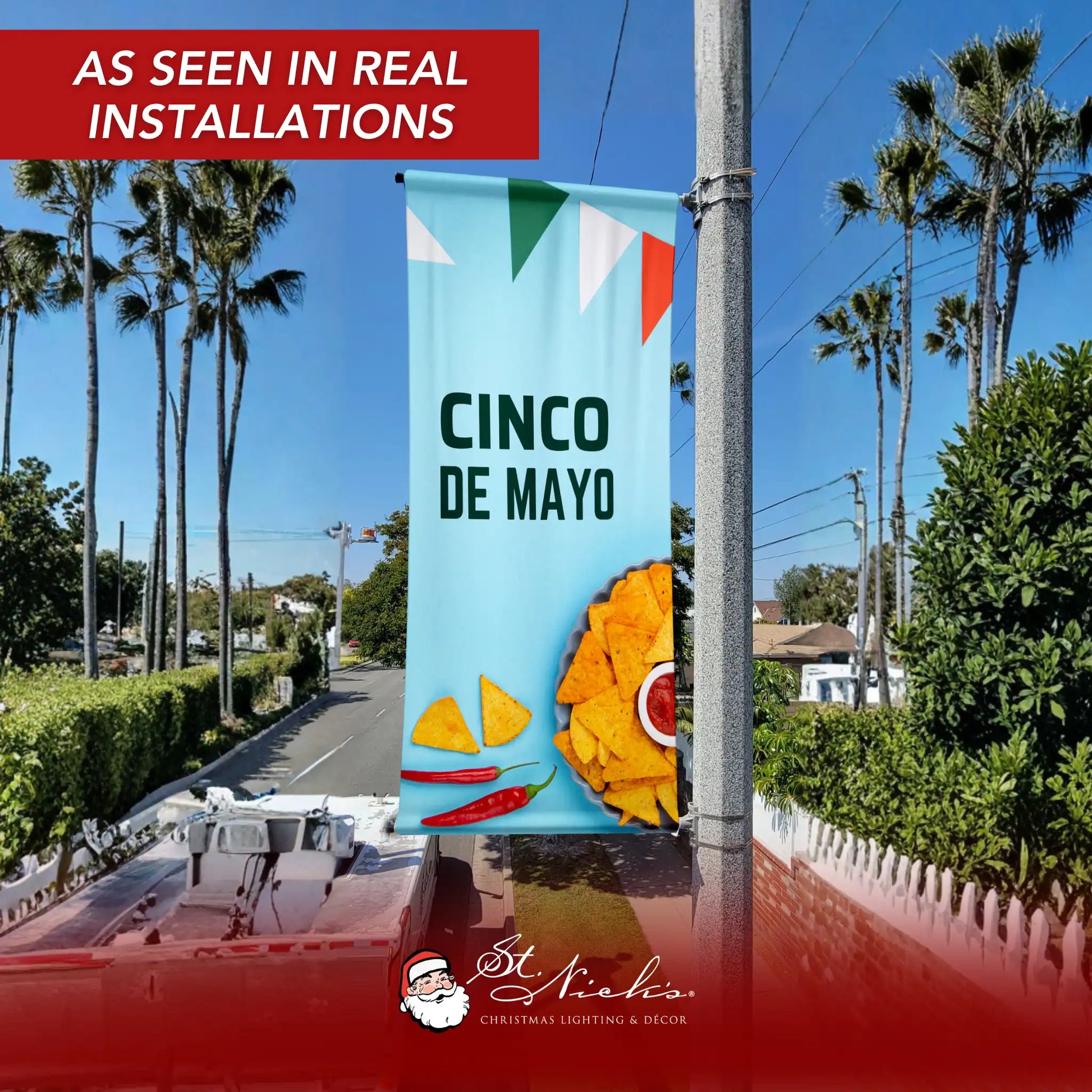 Cinco de Mayo tortilla chip pole banner installed on a street pole in a real downtown environment