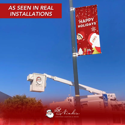 Happy Holidays Christmas pole banner installed on street pole during real commercial installation