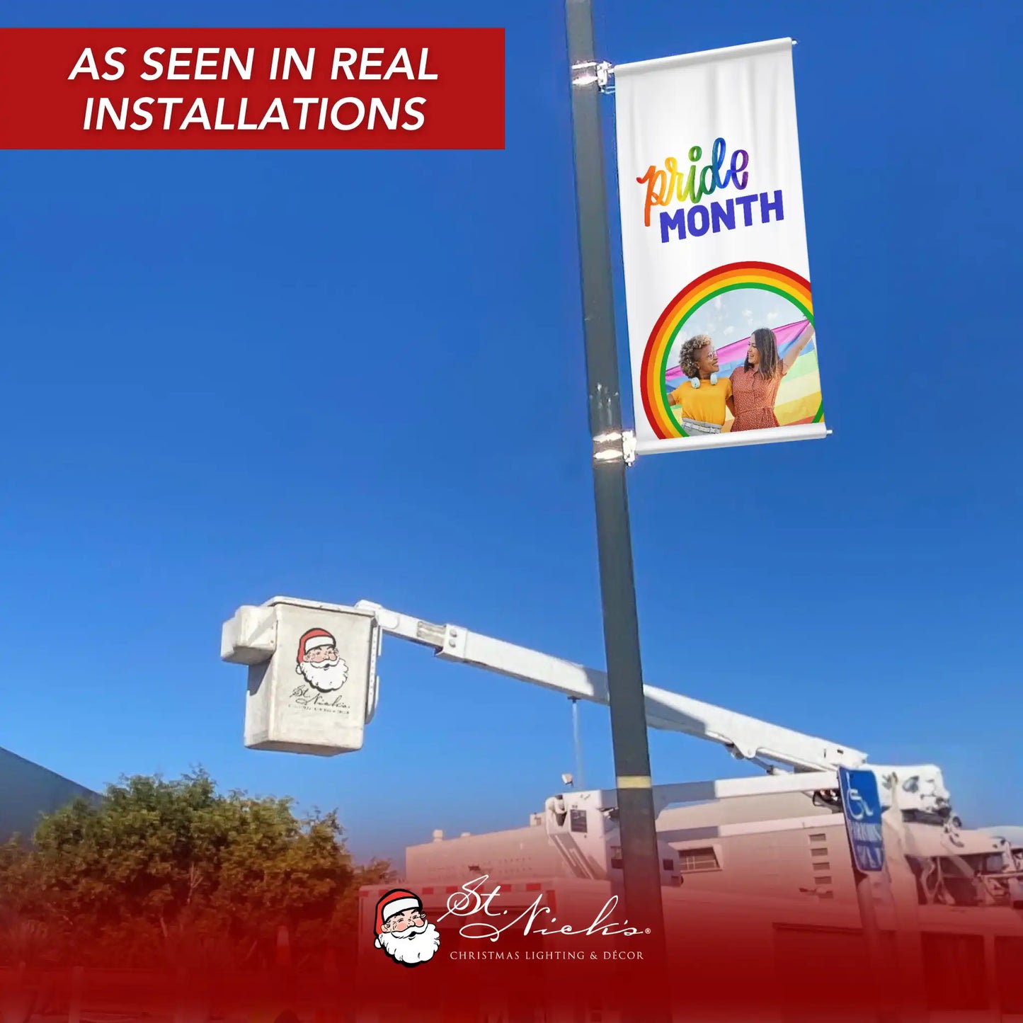 Pride Month photo pole banner displayed on street pole in real installation under blue sky