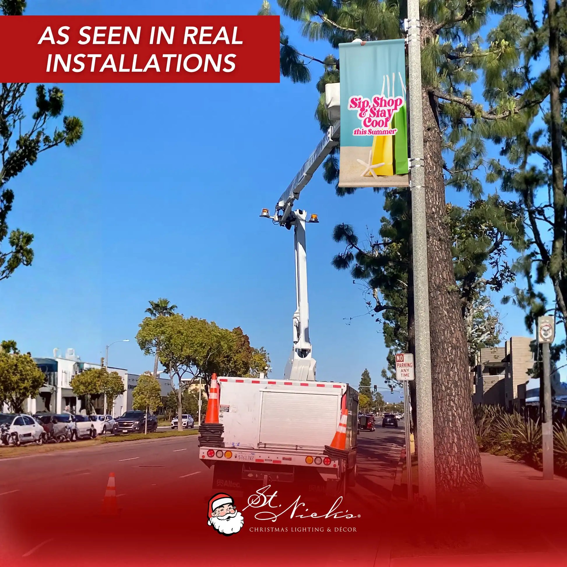 Sip Shop Stay Cool light blue street banner installed on light pole for summer retail promotion