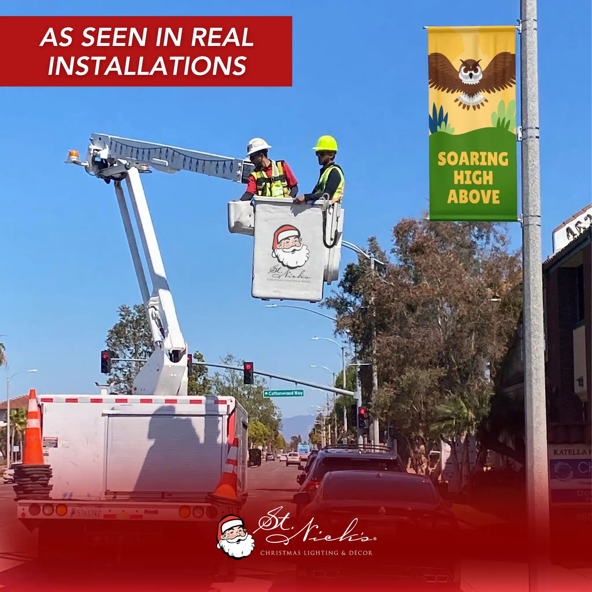 Soaring High Above owl street banner installed on streetlight pole outdoor display
