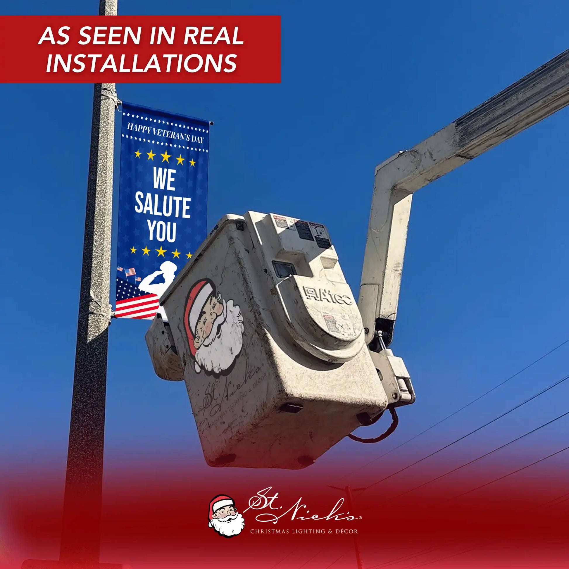 We Salute You blue Veterans Day street banner installed on light pole