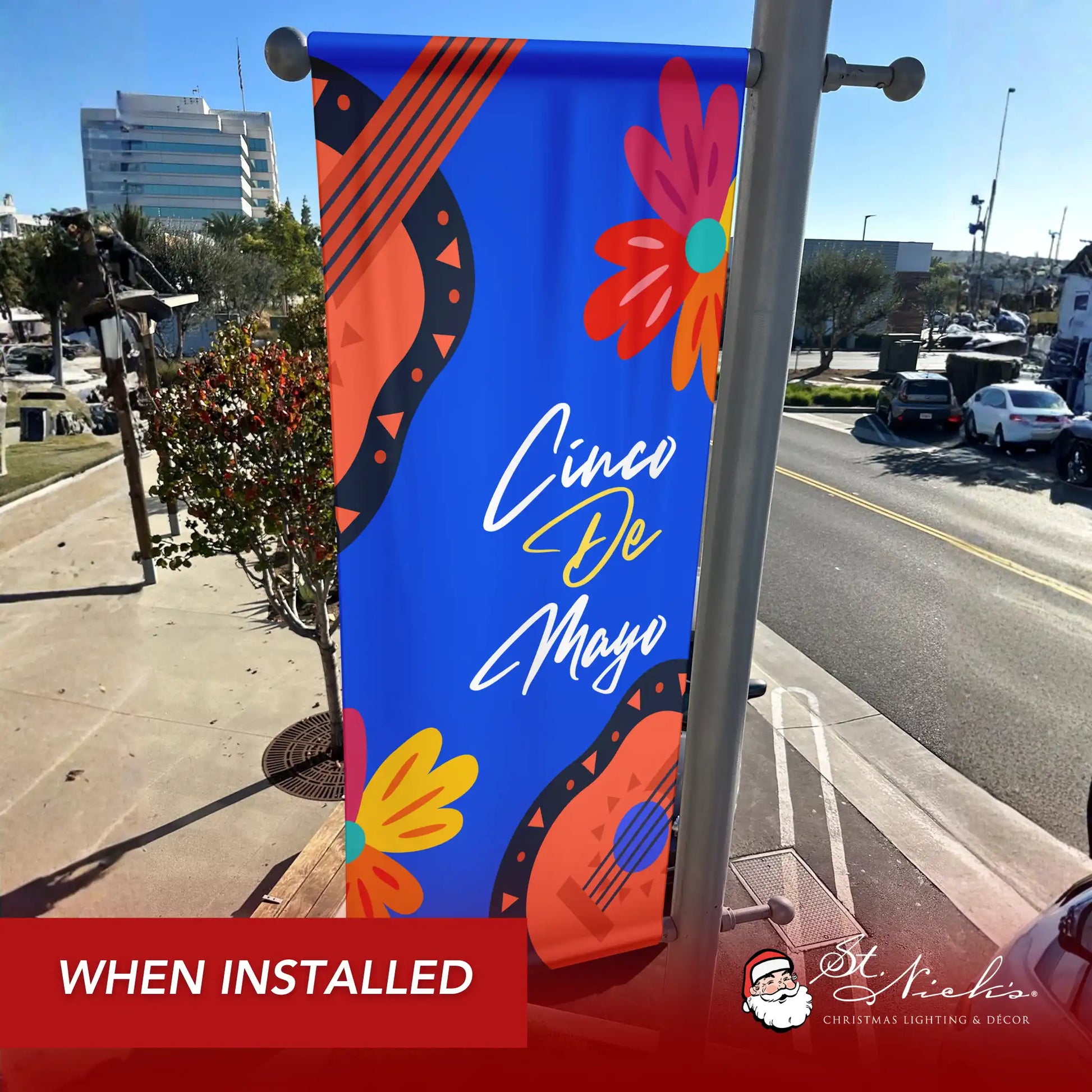 Cinco de Mayo blue guitar floral pole banner shown installed on city street pole