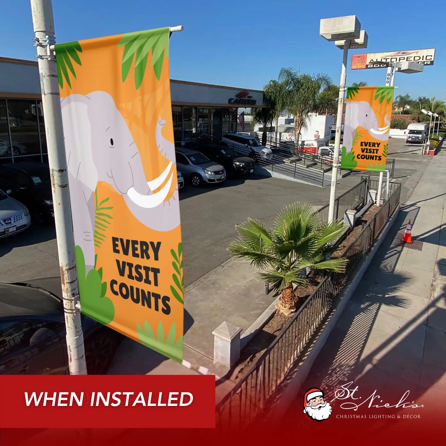 Every Visit Counts elephant street pole banners displayed along sidewalk installation