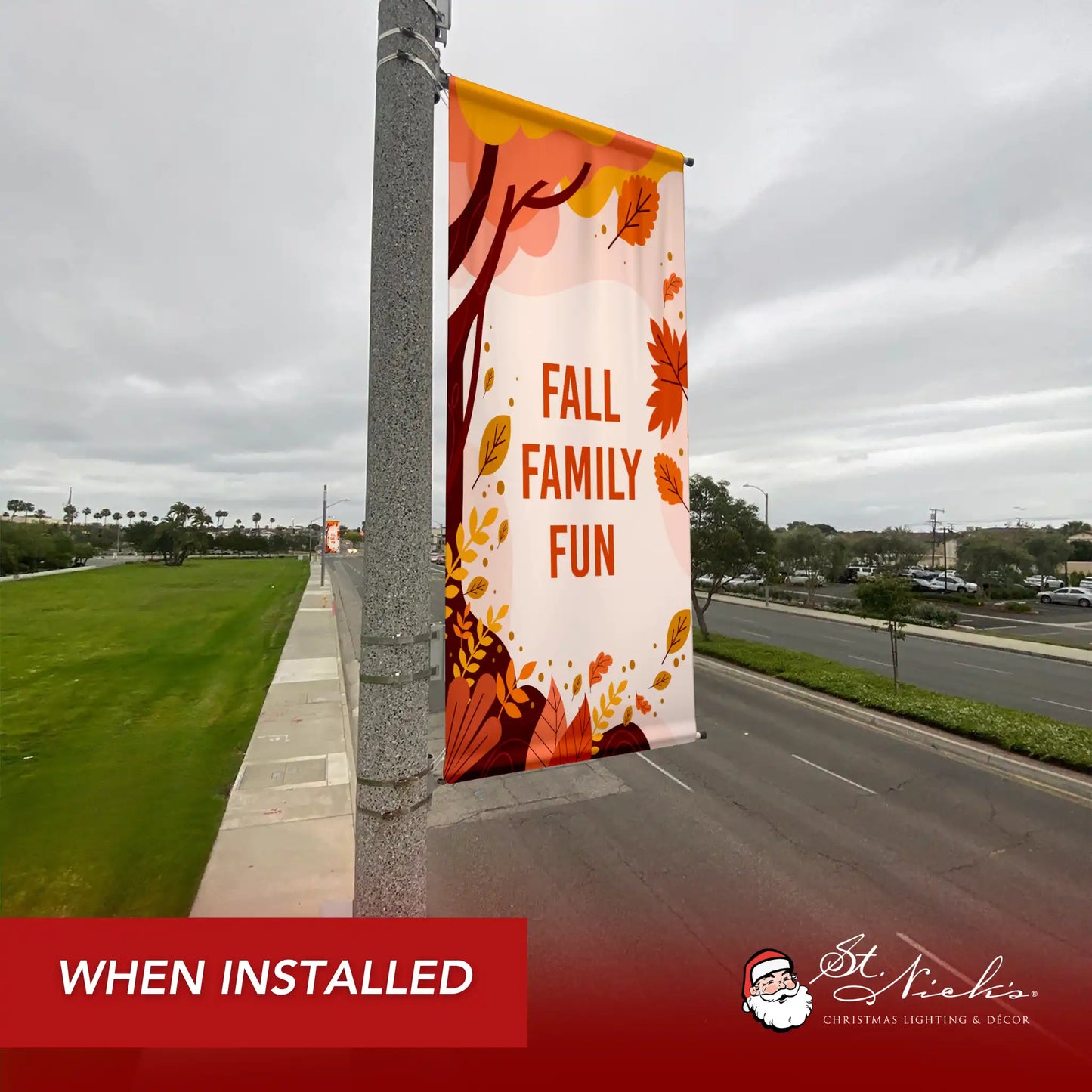Fall Family Fun fall pole banner installed along city street for seasonal fall décor