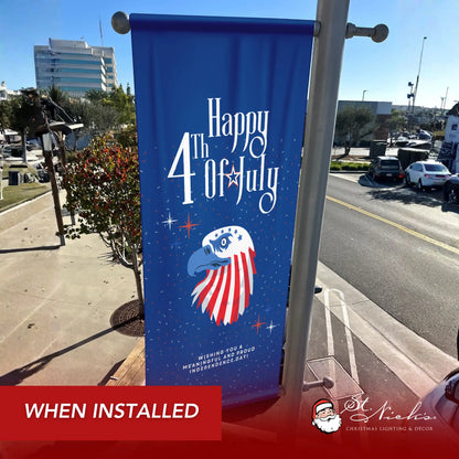 Happy 4th of July eagle pole banner installed along city street for patriotic Independence Day décor