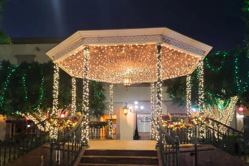 Decorative gazebo with string lights at night