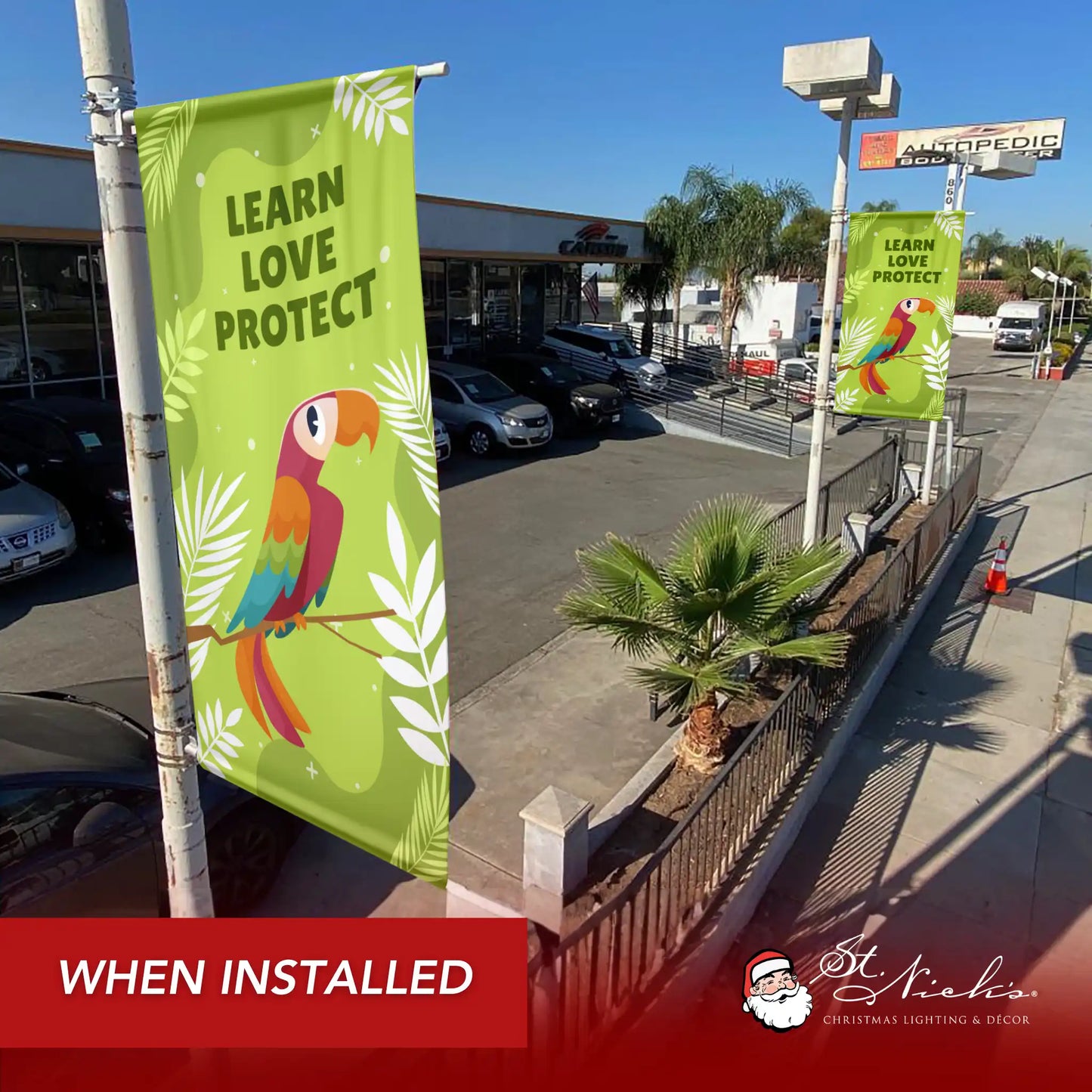 Learn Love Protect green outdoor street banner displayed along commercial walkway