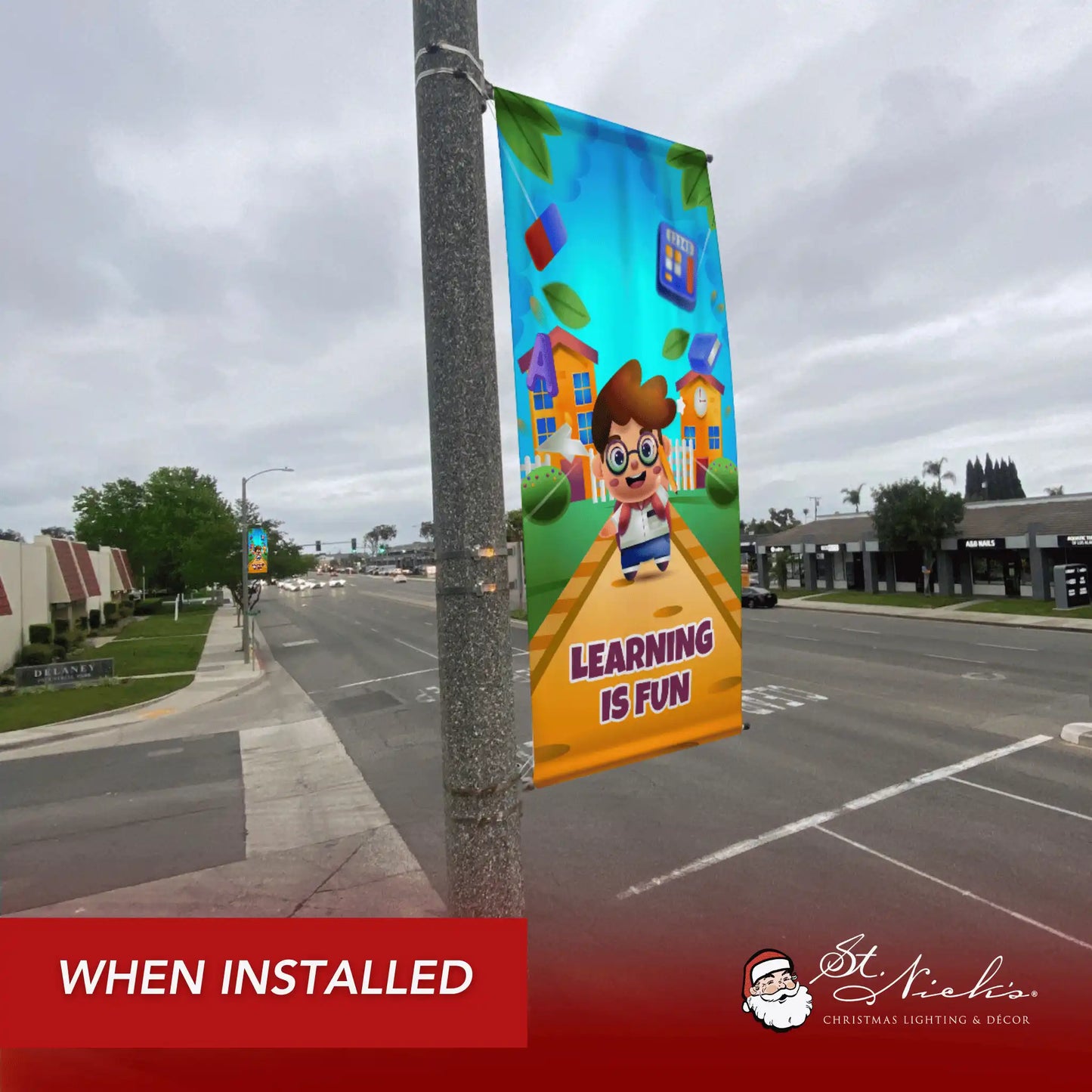 Learning Is Fun school pole banner installed along city street for back-to-school décor