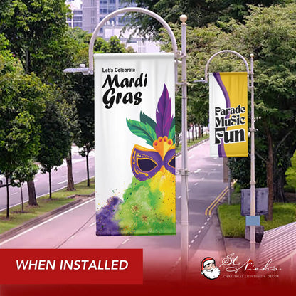 Let’s Celebrate Mardi Gras mask pole banner displayed along city street during seasonal installation