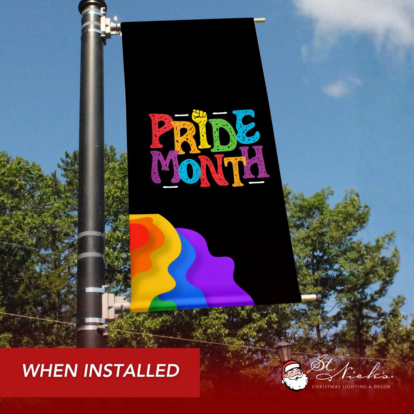 Black Pride Month pole banner with rainbow wave design shown installed on downtown street pole