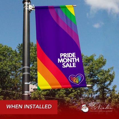 Pride Month Sale rainbow wave pole banner shown installed on city street pole