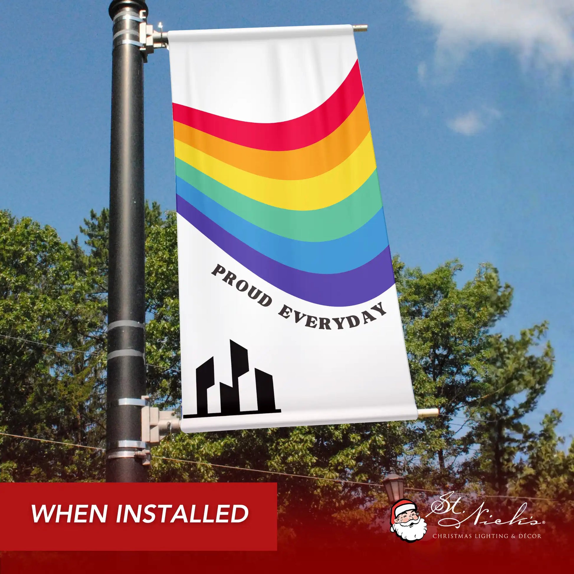 Proud Everyday pride pole banner with rainbow wave design shown installed on city street pole