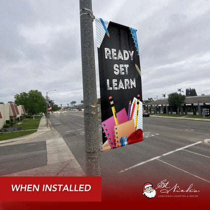 Ready Set Learn school pole banner installed along city street for back-to-school décor