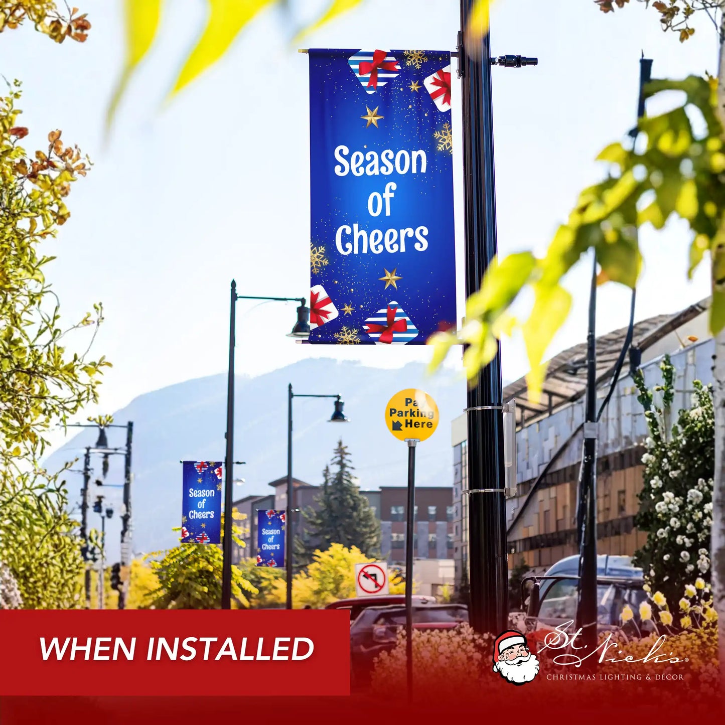 Season of Cheers Christmas pole banner installed along city street for seasonal décor