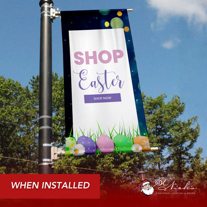 Shop Easter pole banner displayed along city street promoting seasonal spring shopping