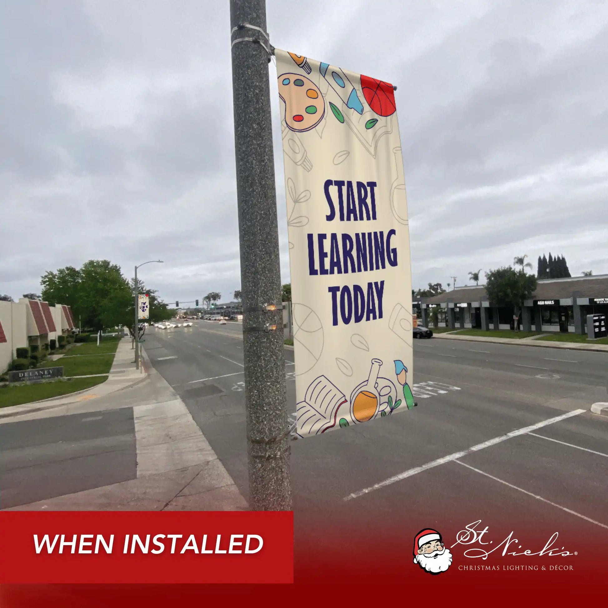 Start Learning Today school pole banner installed along city street for back-to-school décor