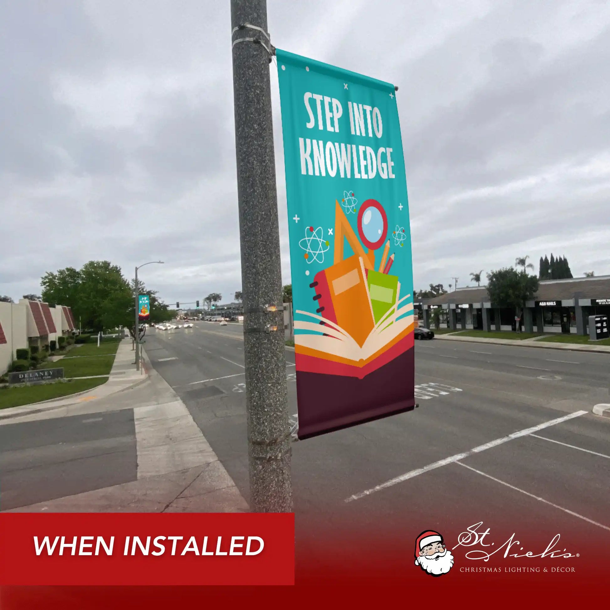 Step Into Knowledge school pole banner installed along city street for back-to-school décor