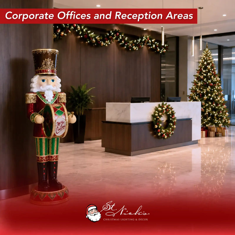 6 foot toy soldier drummer nutcracker displayed in a corporate office reception area with Christmas tree, garland, wreath, and lobby holiday décor