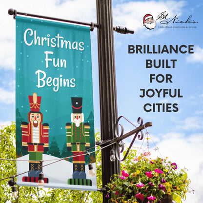 Christmas Fun Begins Christmas pole banner promoting joyful holiday street décor with classic nutcracker imagery