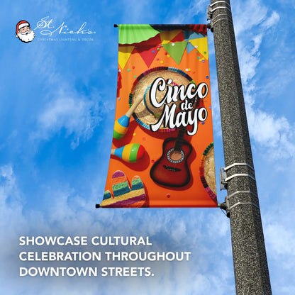 Cinco de Mayo fiesta instruments pole banner promoting cultural celebration and vibrant downtown street décor