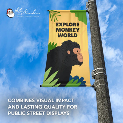 Explore Monkey World yellow street banner with monkey illustration against blue sky