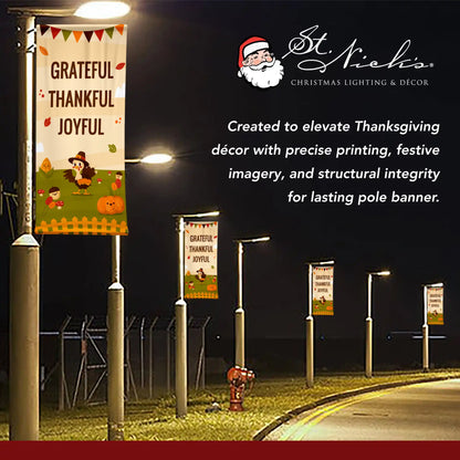 Grateful Thankful Joyful Thanksgiving pole banner illuminated at night for seasonal street decoration