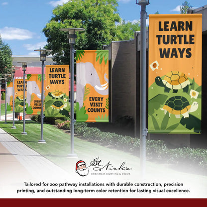 Learn Turtle Ways turtle banner displayed along zoo pathway with animal themed banners