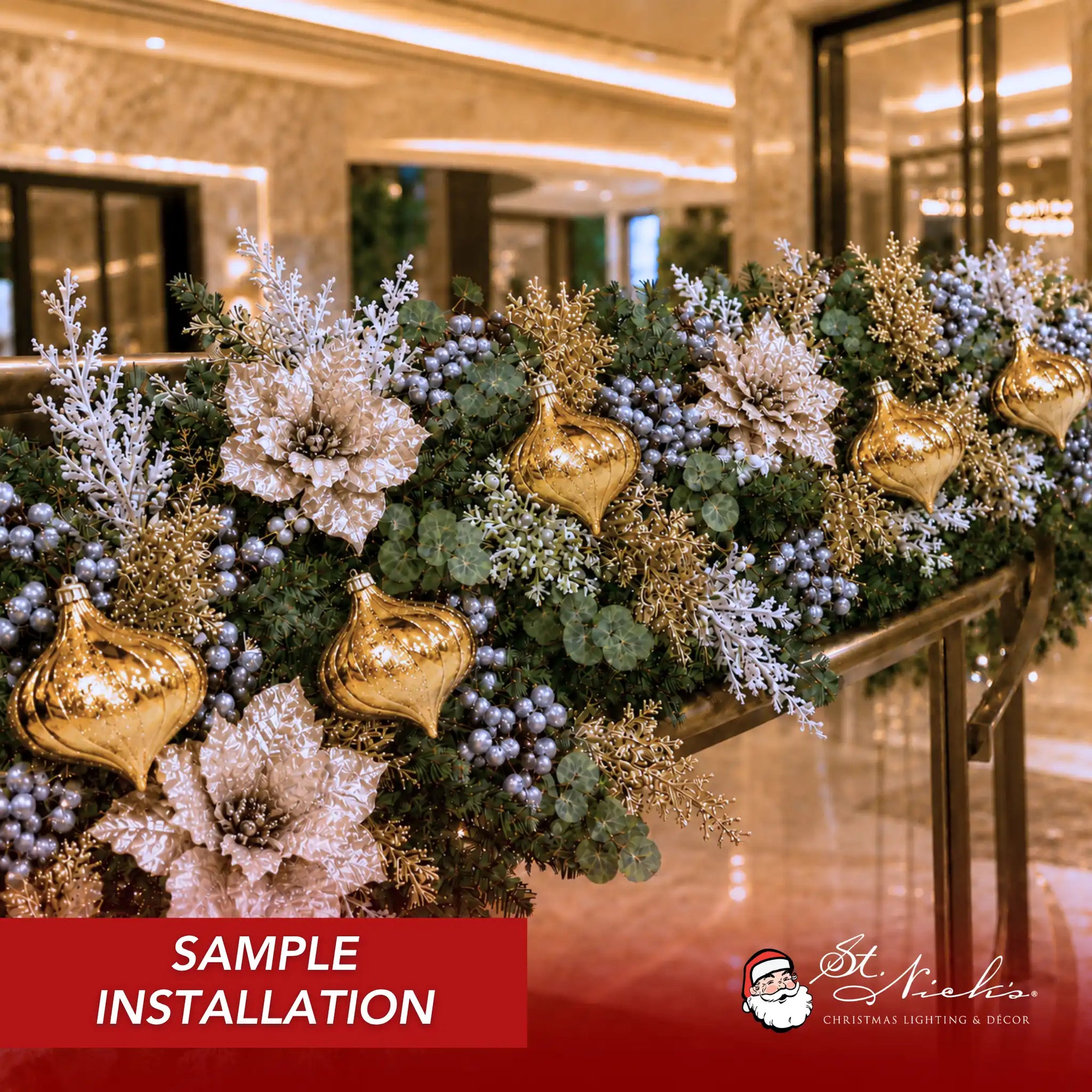 Gold shiny glitter onion ornaments installed throughout a commercial Christmas garland with champagne poinsettias, silver berries, and metallic foliage accents