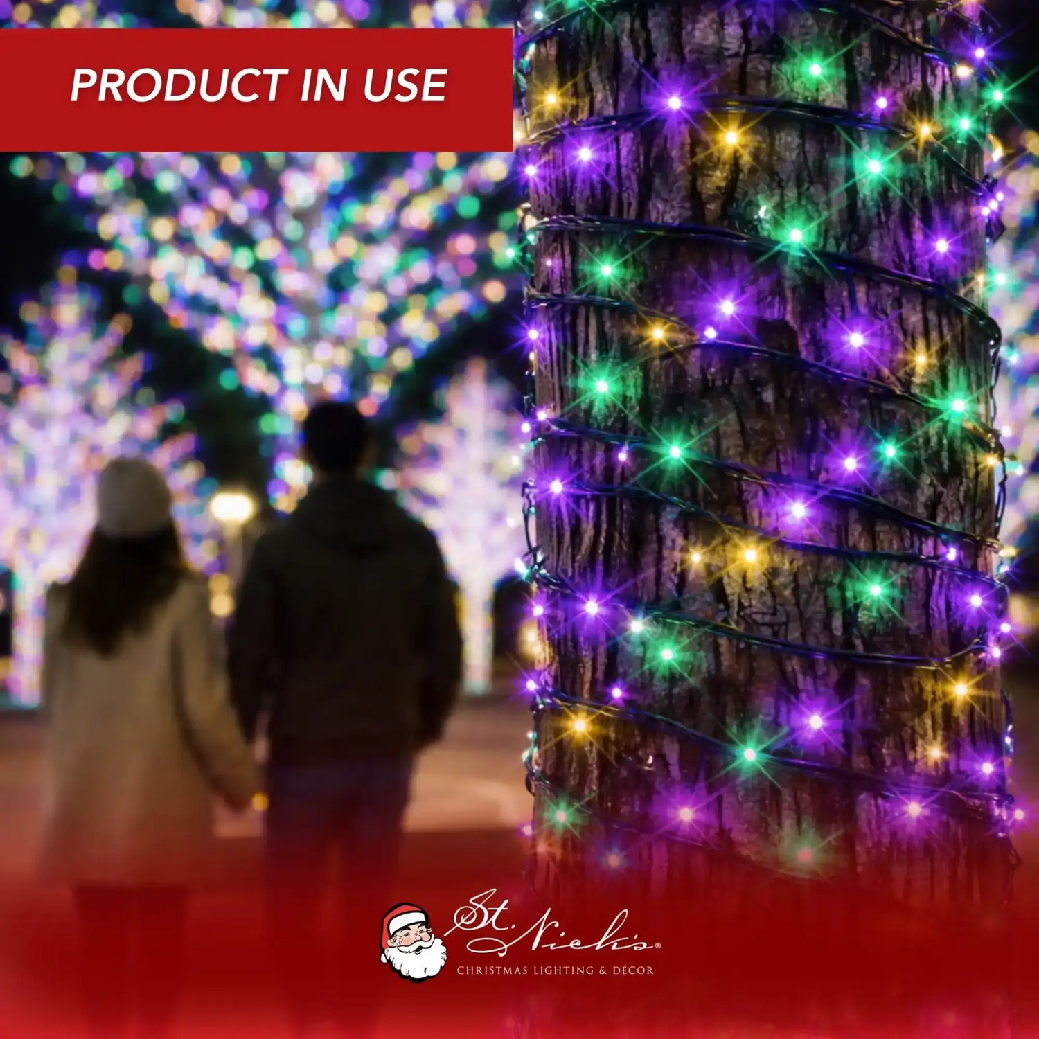 French Quarter Color Palette LED mini lights wrapped around tree trunk in nighttime outdoor display with pedestrians in background