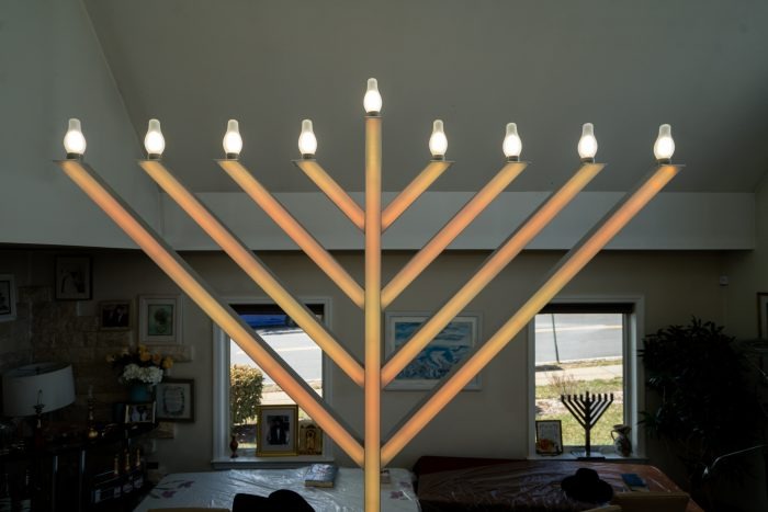 Large menorah with lit candles 