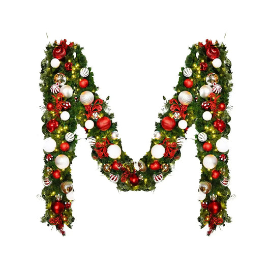 Decorative letter 'M' made of Christmas garland with ornaments 