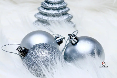 Silver Christmas ornaments with glittery textures