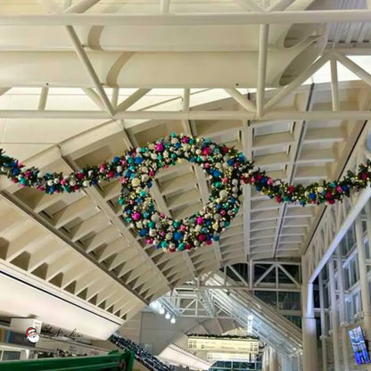 Decorative wreath hanging from a ceiling in a building interior
